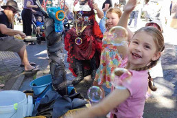 kids with happy faces engoying a bubble show - maitland train station steamfest